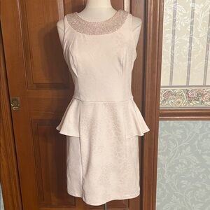 Elegant Sleeveless Light Pink Dress with Peplum Accent. Women’s size 12